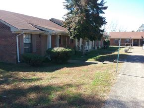Mcewen apartment for rent - a house with a sidewalk in front of it